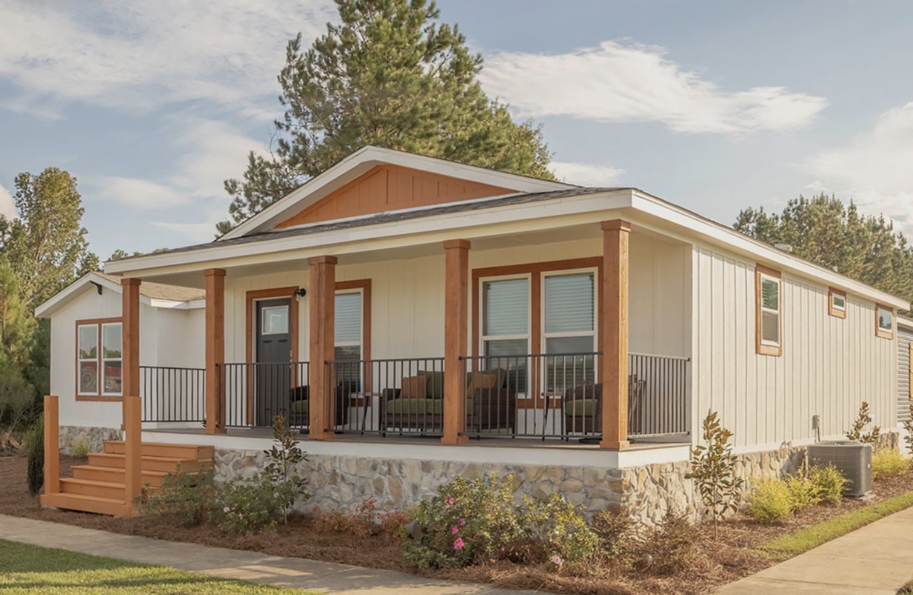 Manufactured home with a covered front porch; model example, features and finishes vary